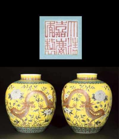 A pair of yellow ground ovoid jars